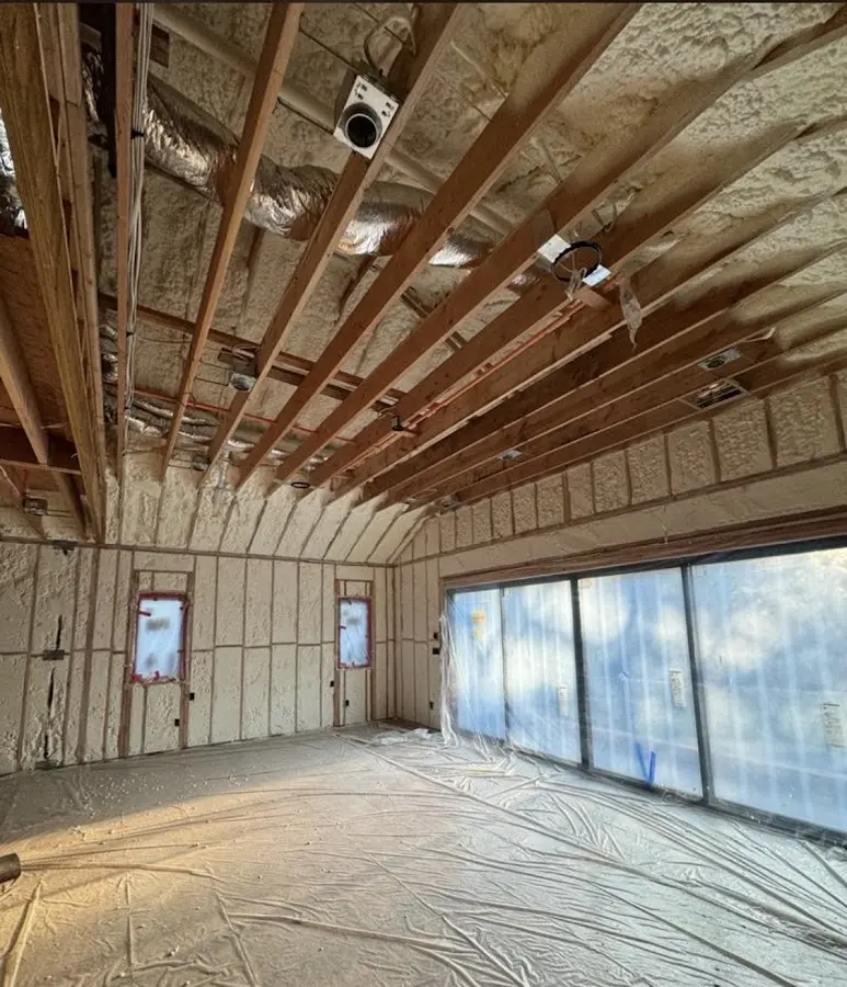 Interior walls and ceiling insulated with spray foam during new construction in Round Rock